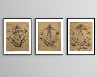May include: Three framed prints with a brown background and black frames. Each print features a black and white drawing of a compass and square with an all-seeing eye above it. The prints are titled "Strong Spirit, Lead from the Spirit".