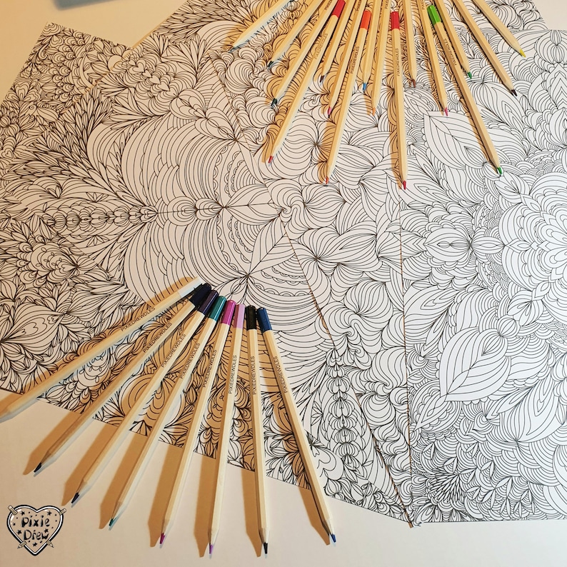 May include: A close-up of a coloring book page with intricate patterns and a variety of colored pencils arranged around it. The pencils are wooden and have a natural finish.