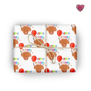 A gift with a highland 
 cattle bull with a balloon tied to it's horn illustration 
 and colourful text with happy birthday in a repeat pattern  wrapping paper