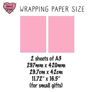 May include: Two rectangular sheets of pink wrapping paper are displayed. The text reads WRAPPING PAPER SIZE, 2 sheets of A3, 297mm x 420mm, 29.7cm x 42cm, 11.72 inches x 16.5 inches, and for small gifts. A heart logo with Pixie Drew is visible.