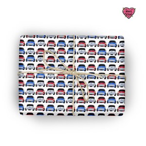 May include: White wrapping paper with a repeating pattern of red, blue and silver miniature cars. The paper is tied with a brown twine bow.