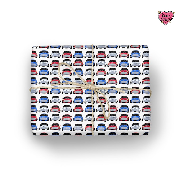 May include: White wrapping paper with a repeating pattern of red, blue and grey miniature cars. The paper is wrapped around a gift box and tied with twine.