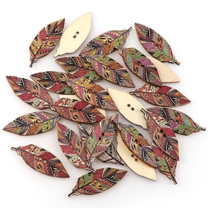 May include: A collection of 20 wooden buttons shaped like feathers with colourful, intricate patterns. The buttons have two holes each and are perfect for crafting projects.