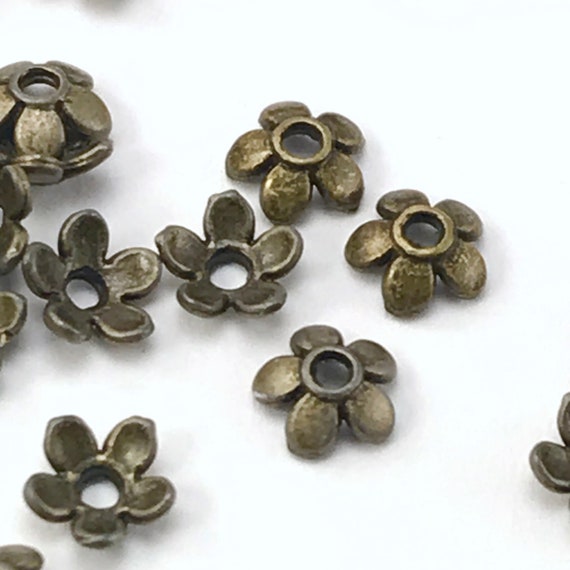 Button, Flower design 12x7mm Button, Flower design 12x7mm