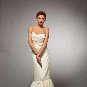 Grace: Silk satin organza strapless gown; pleated top over tired skirt with empire waist.