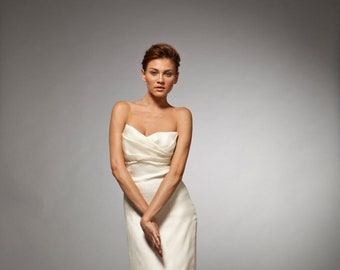 Grace: Silk satin organza strapless gown; pleated top over tired skirt with empire waist.