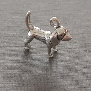 Limited edition sterling silver hound dog charm measuring 17mm x 14mm. Weight of charm is 3.26 grams.