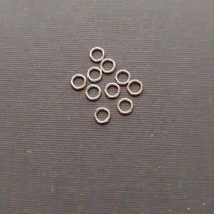 10 Pieces 6mm, and 9mm 21 gauge .925 Sterling Silver Closed Rings. Made in USA.