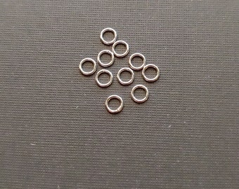 10 Pieces 6mm, and 9mm 21 gauge .925 Sterling Silver Closed Rings. Made in USA.