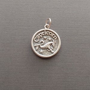 Limited edition sterling silver Capricorn zodiac charm measuring 18mmm. Weight of charm is 4.42 grams.