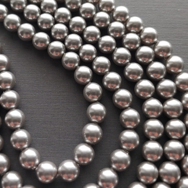 Swarovski 5810 Crystal 8mm Round Light Grey Pearl Beads for Jewelry Stringing and Knotting Jewelry. Sold 50 beads per strand.