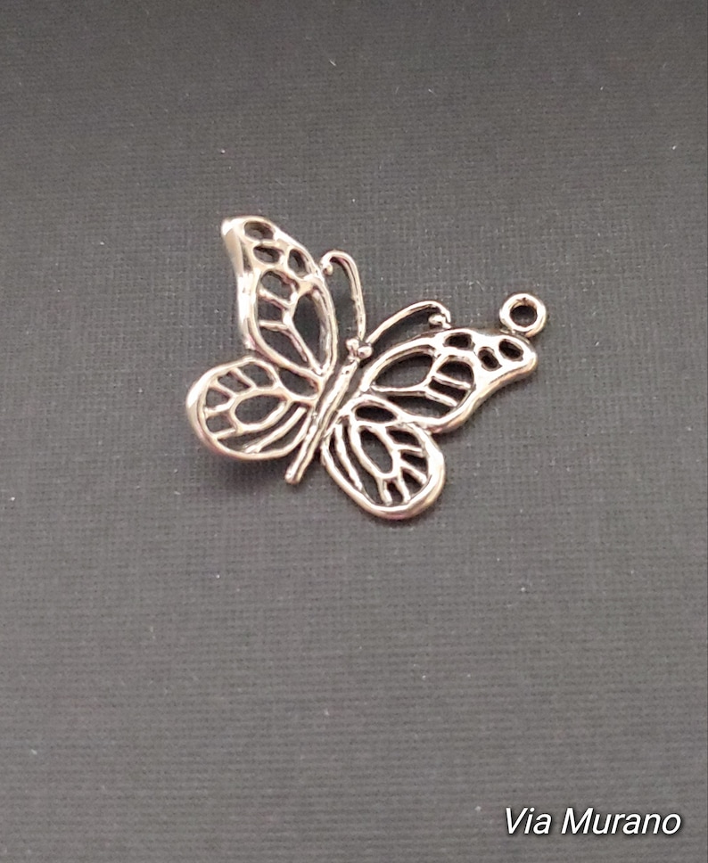 Weight of charm is 2.39 grams. Limited edition sterling silver butterfly charm measuring 24mmx17mm
