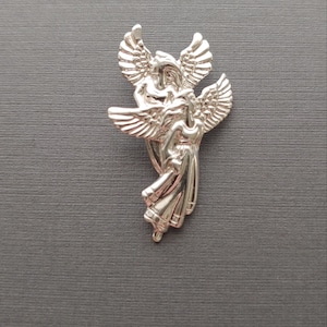 Limited edition sterling silver double angel charm measuring 35mmx20mm. Weight of charm is 3.69 grams.