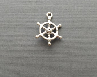 Limited edition sterling silver ship wheel charm measuring 16mm. Weight of charm is 1.18 grams.