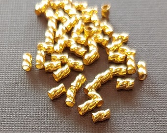 Perlina Twisted Tornado Crimp® in oro 24 kt ULTRAPLATE® .019, 3 mm (scegli la dimensione della confezione). Prodotto negli Stati Uniti.