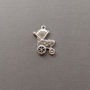 Limited edition sterling silver baby stroller charm measuring 19mmx16mm. Weight of charm is 1.89 grams.