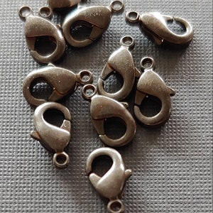 Choose from 9mm 11mm 13mm 19mm 22mm Lobster Clasp Finding Antique Bronze Plated.  Lobster claw in 5 sizes antique bronze plate.