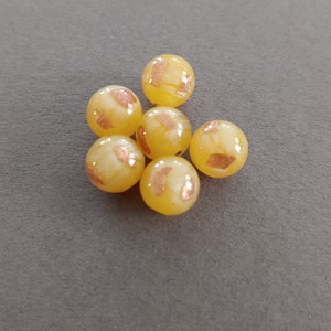 Bead lot of 6 Czech made round satin with gold lamp worked glass beads approximately 10mm in diameter. Made in Czech Republic.