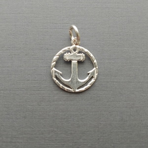 Limited edition sterling silver anchor charm measuring 16mm. Weight of charm is 1.24 grams.