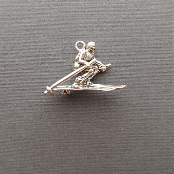 Limited edition sterling silver skier charm measuring 23mmx16mm. Weight of charm is 2.75 grams. Made in USA.