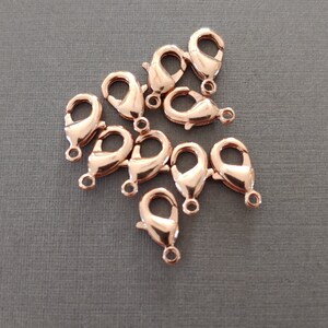 11mm Lobster Clasp Finding DuroPlate 24 kt. Pure Rose Gold Plated.  Lobster claw in 24 kt. Rose Gold Plate