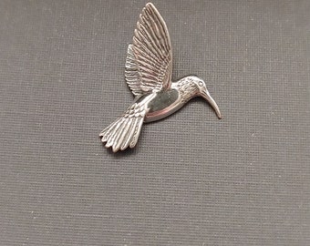 Limited edition sterling silver bird charm measuring 25mmx30mm. Weight of charm is 3.92 grams. Made in USA.