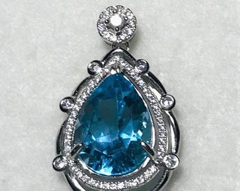 Swiss Blue Topaz and White Sapphire Rhodium Over Sterling Silver Pendant