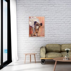 May include: A painting of a ballerina in a white tutu, tying her shoe. The background is a soft pink and orange.