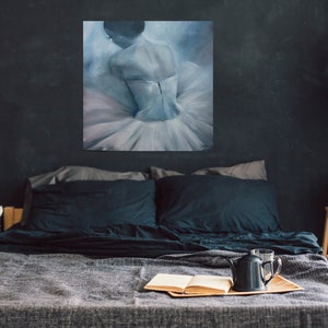 May include: A bedroom with a dark grey wall, a bed with black bedding, a painting of a ballerina in a white tutu, a bedside table with a small plant and a brown paper bag, and a black lamp hanging from the ceiling.