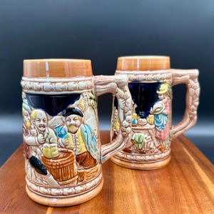 Vintage Stoneware Beer Steins: German Tavern Scene, Made in Japan (Pair)