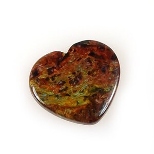 May include: A heart-shaped tiger's eye stone with a brown, red, gold, and green color pattern.