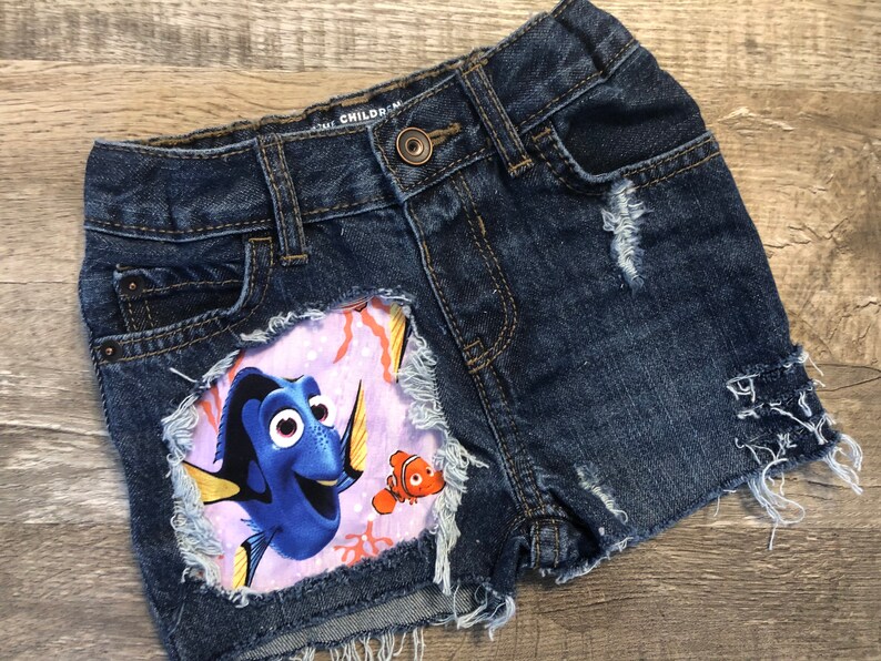 Finding Dory Nemo birthday Disney shorts girls do distressed patched denim cut offs made with dory fabric