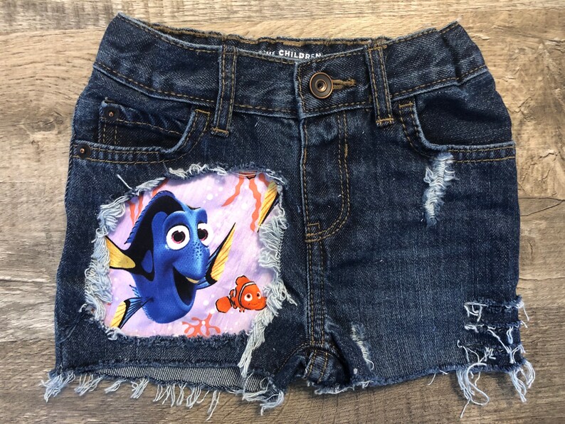 Finding Dory Nemo birthday Disney shorts girls do distressed patched denim cut offs made with dory fabric