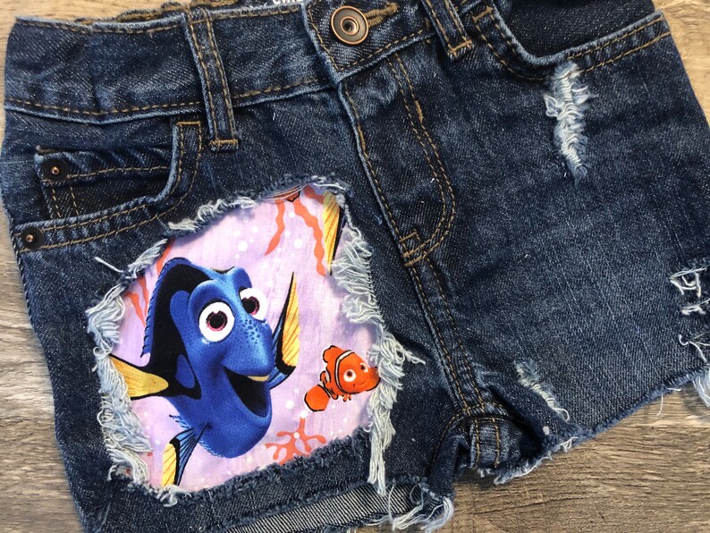 Finding Dory Nemo birthday Disney shorts girls do distressed patched denim cut offs made with dory fabric