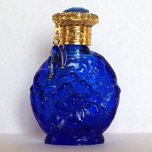 Two blue tinted glass perfume bottles Two blue tinted glass perfume bottles