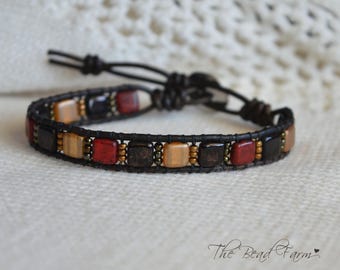Leather Bracelet- a Boho style leather bracelet in black, red, and gold
