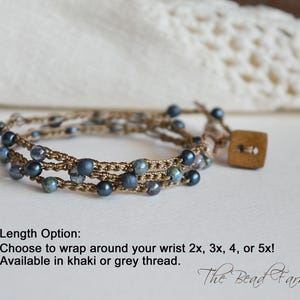 May include: A multi-strand wrap bracelet with dark blue beads and a wooden button closure. The bracelet is made with khaki-colored thread. Text on the image reads: "Length Option: Choose to wrap around your wrist 2x, 3x, 4, or 5x! Available in khaki or grey thread."