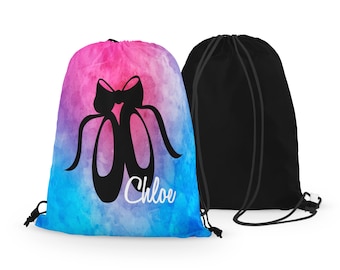 May include: A blue and pink watercolor drawstring bag with a black silhouette of ballet shoes and a bow. The bag has the name "Chloe" written in white on the front.