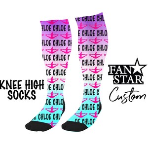 May include: A pair of knee-high socks with a gradient design in pink, blue, and white. The socks feature a repeated pattern of a pink silhouette of a person doing a cheerleading pose and the text "Chloe" in black. The socks are black at the toes and heels. The text "FAN STAR Custom" is visible in the image.
