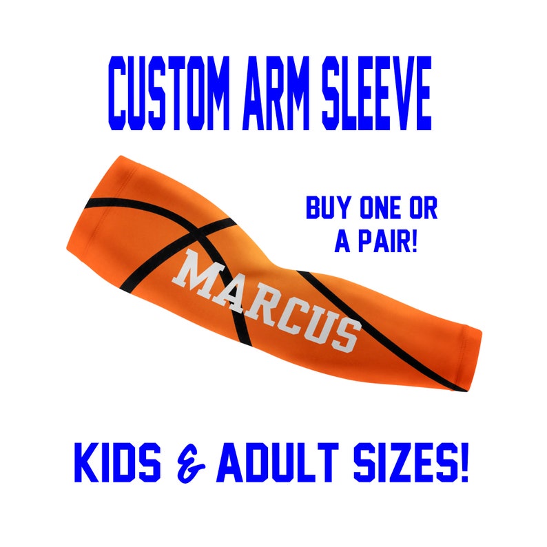 May include: Orange and black basketball arm sleeve with the name "MARCUS" printed in white.  "CUSTOM ARM SLEEVE" and "BUY ONE OR A PAIR!" are printed in blue.  "KIDS & ADULT SIZES!" is printed in blue at the bottom.