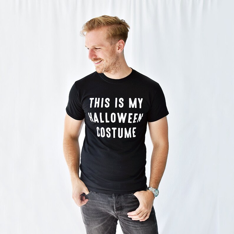 May include: A black t-shirt with white text that reads "This is my Halloween costume."