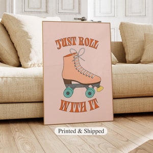 May include: Pink and orange roller skate graphic with the text "Just Roll With It" on a pink background.