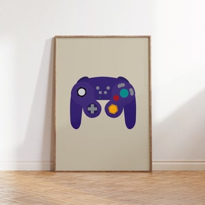 May include: A framed print of a purple video game controller with colorful buttons. The controller is a popular design from the early 2000s.