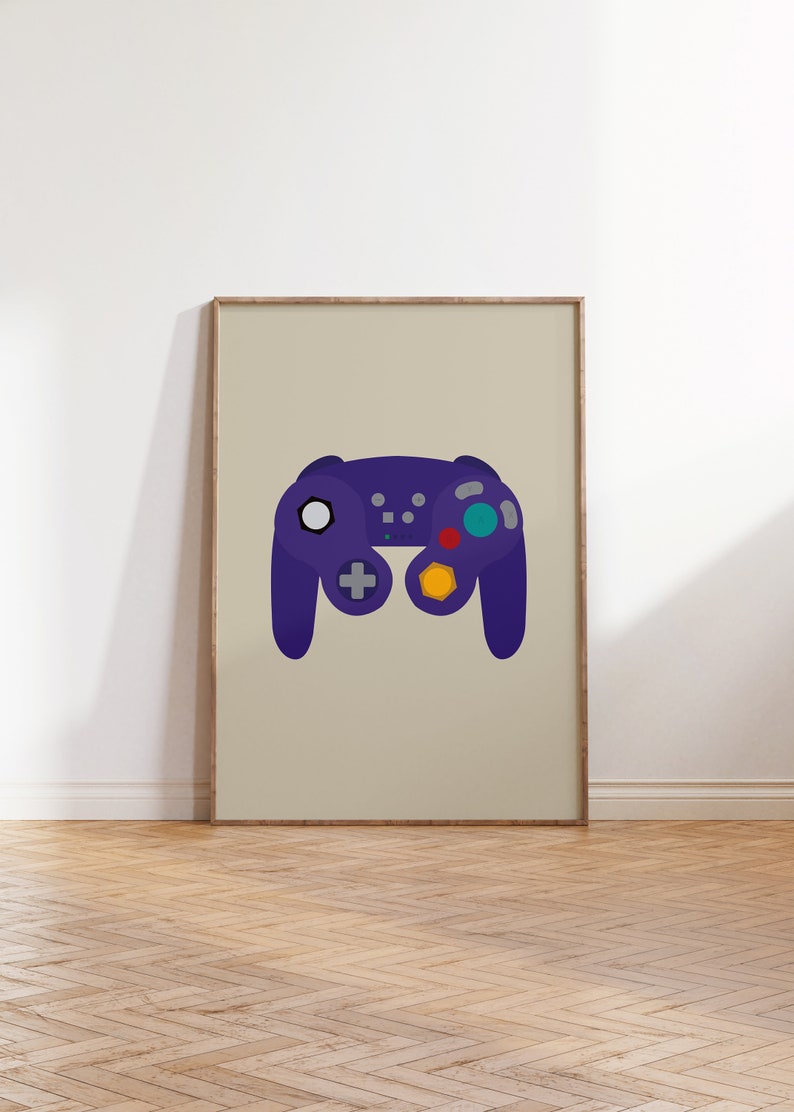 May include: A framed print of a purple video game controller with colorful buttons. The controller is a popular design from the early 2000s.