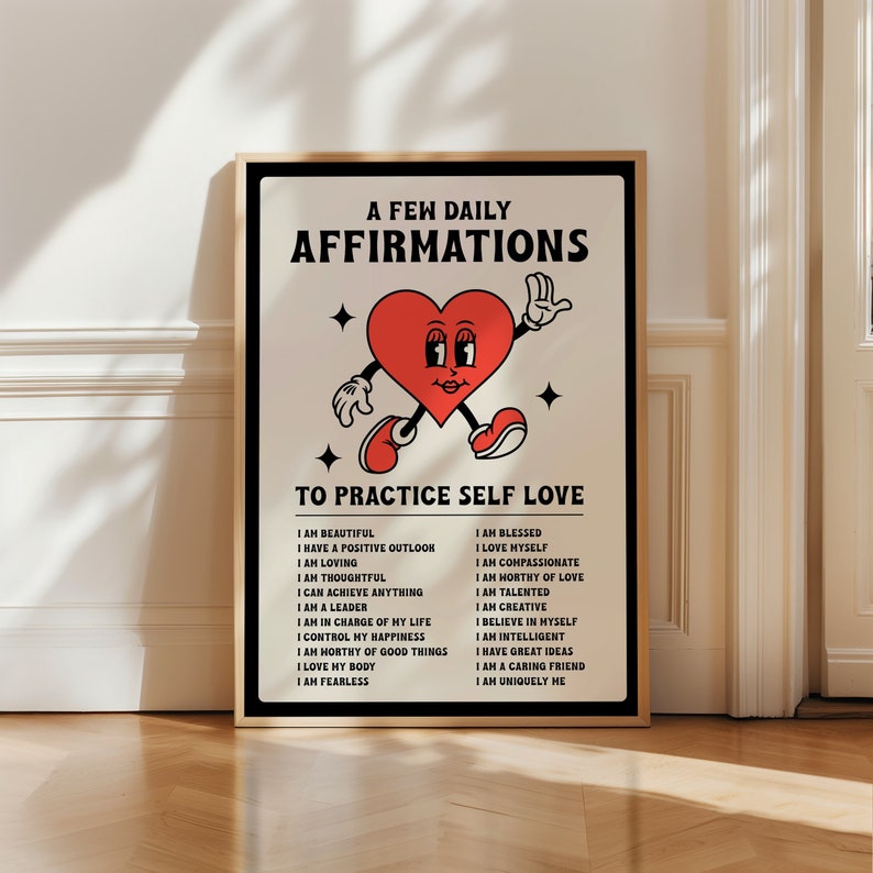 May include: A framed poster with a retro design featuring a red heart character with arms and legs. The poster reads "A Few Daily Affirmations To Practice Self Love" with a list of positive affirmations.