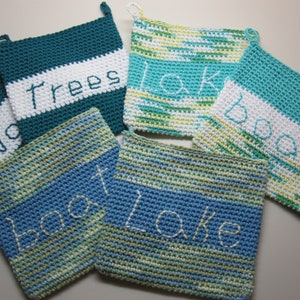 May include: Five crocheted pot holders with different colors and designs. Each pot holder has a word embroidered on it: "No Trees", "Lake", "Boat", "Lake", and "Boat".