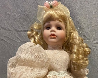 Porcelain Doll with Lace Dress - Puffed Sleeves - Long Curly Blond Hair - Brown Eyes and Stand - 13 inches tall