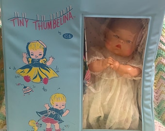 Ideal Tiny Thumbelina Doll with case, layette, bag and cloth diapers