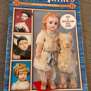 May include: A book titled "Doll Values: Antique to Modern" with a cover featuring three dolls and a stuffed animal. The book is the fifth edition and claims to be the #1 bestselling doll book.
