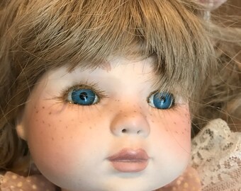 15" Porcelain Blond doll with Freckles - Doll Body is completely porcelain and strung together - wearing pink lace dress